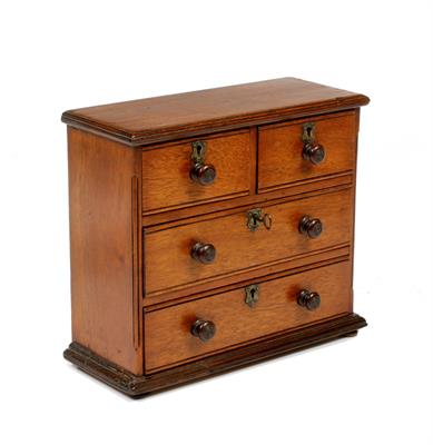 Lot 455 - A 19TH CENTURY MAHOGANY MINIATURE CHEST OR APPRENTICE PIECE CHEST OF TWO SHORT AND TWO LONG DRAWERS