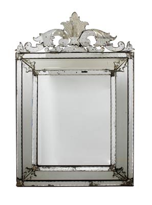 Lot 457 - AN 19TH CENTURY VENETIAN WALL MIRROR the central rectangular bevelled mirror plate surrounded by a m