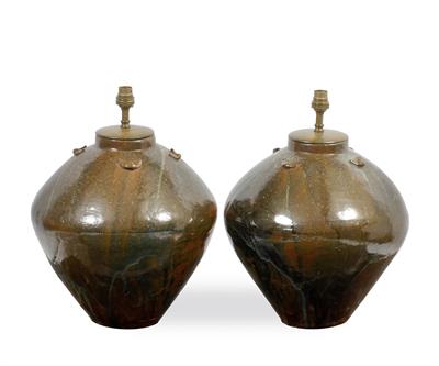 Lot 461 - A PAIR OF VIETNAMESE STONEWARE OVOID JARS converted for use as table lamps 33cm high