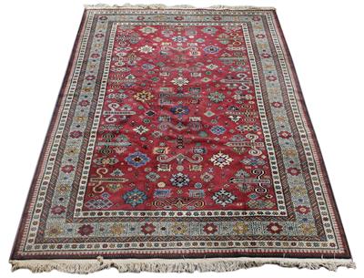 Lot 484 - A MIDDLE EASTERN KAZAK AUBERGINE GROUND SMALL CARPET with a multiple banded border and all over styl