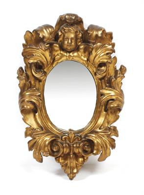 Lot 487 - AN 18TH CENTURY ITALIAN CARVED GILTWOOD WALL MIRROR with a cherubs head crest and scrolling acanthus