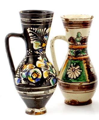 Lot 490 - A GROUP OF THREE ANTIQUE TURKISH TIN GLAZED AND ENAMEL DECORATED TERRACOTTA JUGS of baluster form wi