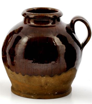 Lot 491 - A LATE 18TH CENTURY STAFFORDSHIRE HONEY POT of ovoid form with loop handle and treacle brown glaze o