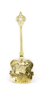 Lot 492 - A 18TH CENTURY PIERCED BRASS SKIMMER with stamped and engraved decoration to the shaped bowl