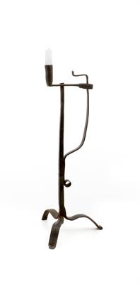 Lot 504 - AN ANTIQUE WROUGHT IRON RUSH LIGHT HOLDER with sprung stay together with a candle socket on a square