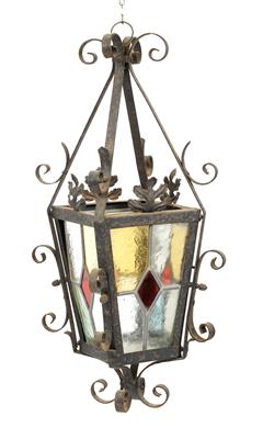 Lot 507 - AN OLD BLACK PAINTED WROUGHT IRON HALL LANTERN the four sides inset with leaded glass panels 50cm hi