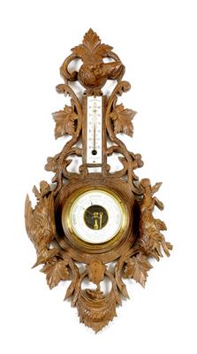 Lot 508 - A CARVED DARK STAINED PINE BLACK FOREST TYPE WALL HANGING ANEROID BAROMETER and thermometer