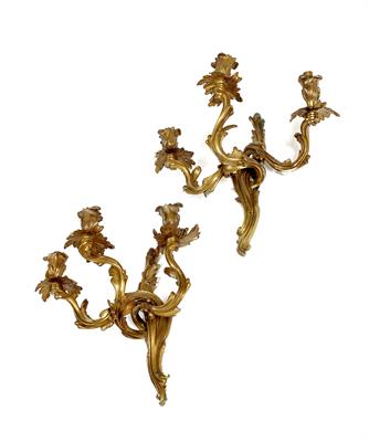 Lot 509 - A PAIR OF GILT METAL ACANTHUS LEAF MOULDED THREE BRANCH WALL LIGHTS each approximately 34cm high (2)