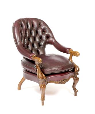 Lot 519 - A VICTORIAN MAHOGANY LIBRARY ARMCHAIR with a purple leather button upholstered back and overstuffed