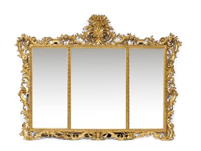 Lot 523 - AN EARLY 19TH CENTURY SCROLLING CARVED WOOD AND GESSO GILDED WALL MIRROR with three rectangular beve