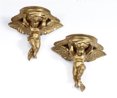 Lot 534 - A PAIR OF GILT GESSO AND CARVED WOOD WALL BRACKETS with winged cherub supports