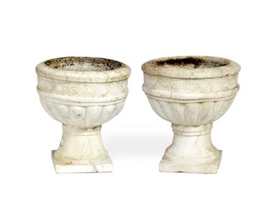 Lot 600 - A PAIR OF GREY VEINED WHITE MARBLE GARDEN URNS with lobed and incised decoration and on square pedes