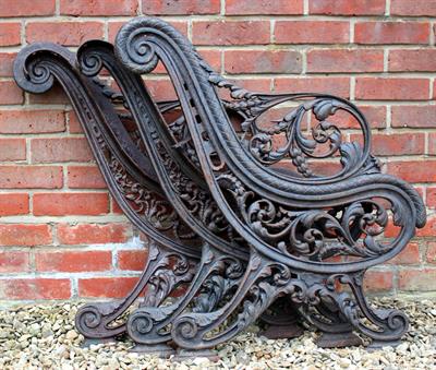 Lot 609 - A VICTORIAN CAST IRON BENCH FRAME of scrolling form decorated with acanthus leaves with two ends and