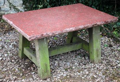 Lot 610 - A RECTANGULAR LOW GARDEN TABLE with red granite top