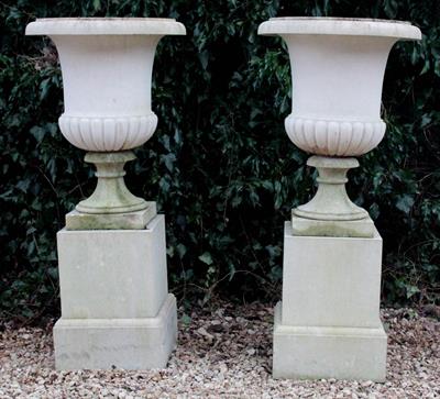 Lot 614 - A PAIR OF HADDONSTONE URNS of campana form