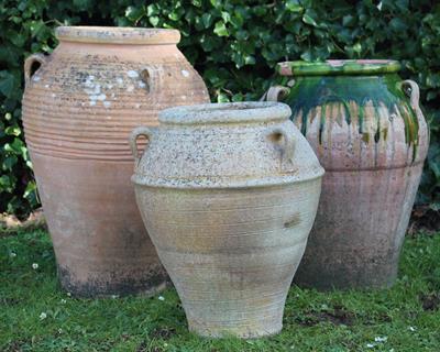 Lot 618 - A TERRACOTTA PITHOI TYPE JAR of inverted baluster form with three loop handles 66cm high together wi