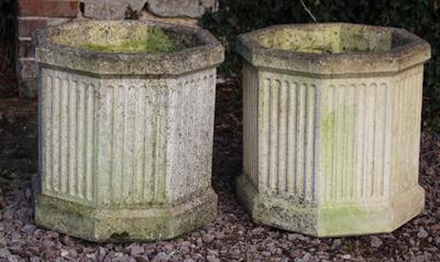 Lot 619 - A PAIR OF ART DECO STYLE CAST CONCRETE FLUTED OCTAGONAL PLANTERS