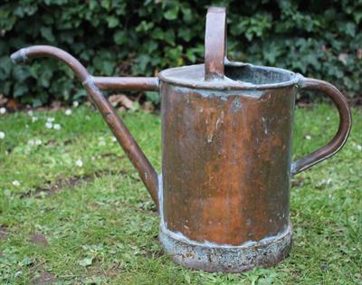 Lot 637 - A 19TH CENTURY COPPER WATERING CAN with two arching handles and a narrow spout