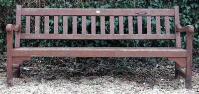 Lot 642 - AN OLD PAINTED WOODEN GARDEN BENCH with a slatted back and seat 180cm wide