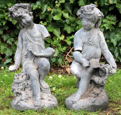 Lot 649 - A PAIR OF FAUX DECORATIVE CHERUBS of classical form