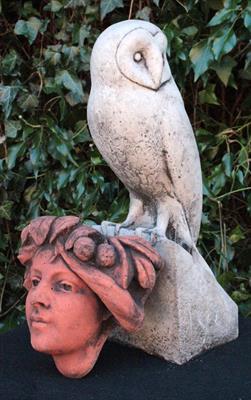 Lot 650 - A CAST COMPOSITE LIFE SIZE BARN OWL 39.5cm together with a small terracotta wall pocket of a girl wi