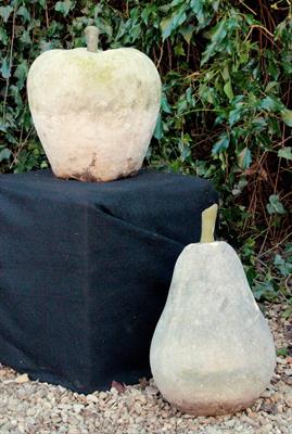 Lot 652 - A CAST RECONSTITUTED STONE SCULPTURE of an apple 35cm high together with a similar sculpture of a pe