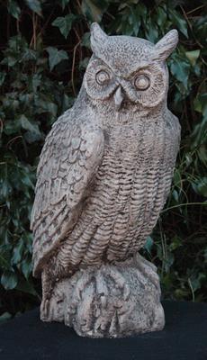 Lot 667 - A CAST COMPOSITE STONE LIFE SIZE FIGURE of a long eared owl 47cm high