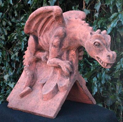 Lot 678 - A ROOF RIDGE TILE FINIAL of a dragon preparing to fly 43cm high