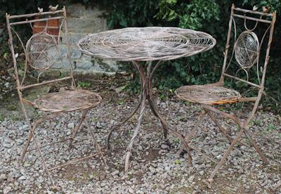 Lot 687 - A BROWN PAINTED WIRE WORK BISTRO SET in the form of intertwined birds