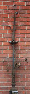 Lot 688 - A VICTORIAN WROUGHT IRON FLOWER HEAD DECORATED FINIAL with riveted branches and mounted on the top o