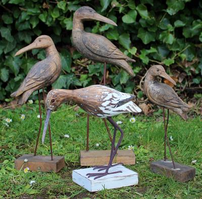 Lot 696 - A GROUP OF THREE CARVED WOODEN BIRDS on wirework legs