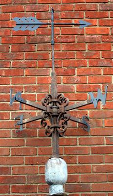 Lot 704 - AN OLD WROUGHT IRON WEATHER VANE with a rotating arrow pointer and points indicating the directions