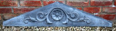 Lot 705 - AN OLD CONTINENTAL ZINC PANEL of triangular form with central flower head surrounded by scrolling ac