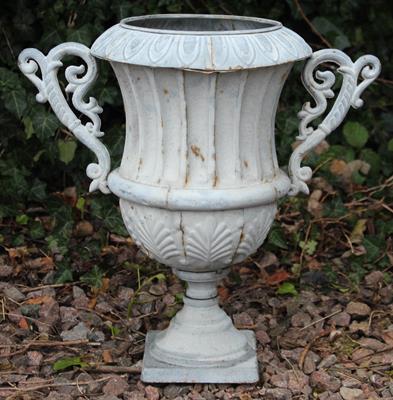 Lot 706 - A CONTINENTAL CAST ZINC SMALL URN with fluted body