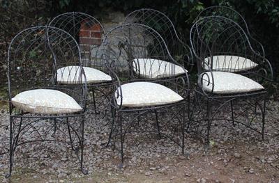 Lot 716 - A SET OF SIX REGENCY STYLE WIREWORK GARDEN ARMCHAIRS with arching backs and scrolling arms and stand