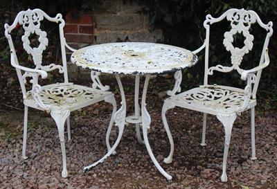 Lot 724 - AN OLD WHITE PAINTED ALUMINIUM CIRCULAR GARDEN TABLE 60cm diameter together with a pair of white pai