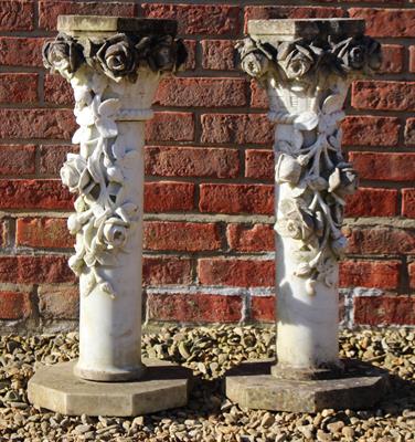 Lot 729 - A PAIR OF CARVED MARBLE COLUMNS with basket capitals and rose swag decoration and on octagonal bases