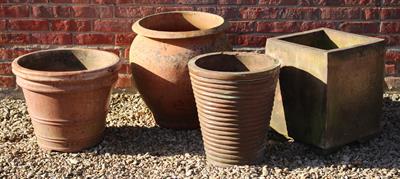 Lot 736 - AN OLD TERRACOTTA OVOID PLANTER with flaring rim 49cm diameter x 53cm high together with a further f