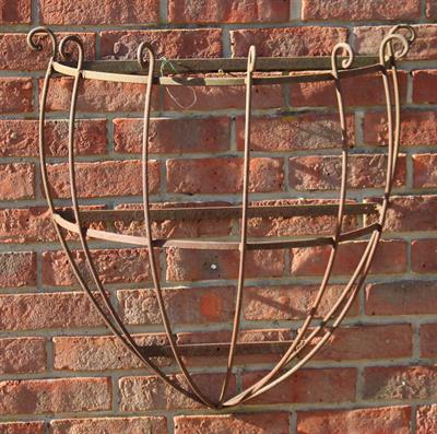 Lot 745 - A WROUGHT IRON WALL MOUNTED HALF ROUND MANGER or basket planter 68cm wide x 69cm high