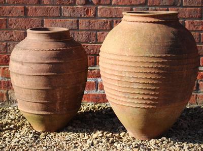 Lot 749 - A GREEK TERRACOTTA OVOID PITHOI TYPE JAR or planter approximately 50cm diameter x 67cm high together