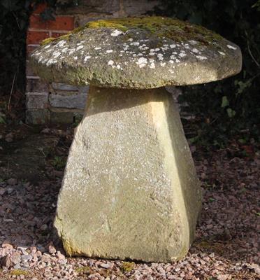 Lot 754 - A LARGE OLD CARVED STADDLE STONE the circular top on a square spreading base 72cm diameter x 72cm hi