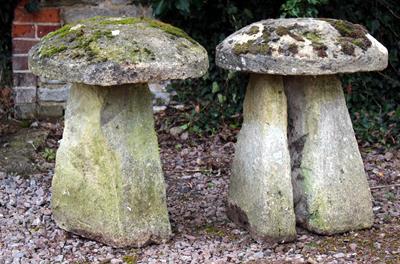 Lot 755 - TWO OLD STADDLE STONES each approximately 51cm diameter x 70cm high (AF) (2)