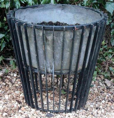 Lot 757 - A WROUGHT IRON PLANTER with vertical slats 58cm high x 62cm diameter