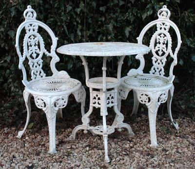 Lot 759 - A WHITE PAINTED CAST ALUMINIUM CIRCULAR GARDEN TABLE with pierced top and shaped tripod support 59cm