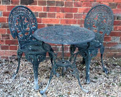 Lot 760 - A GREEN PAINTED CAST ALUMINIUM CIRCULAR GARDEN TRIPOD TABLE with pierced top 66cm diameter together