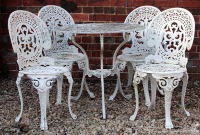 Lot 764 - A WHITE PAINTED CAST ALUMINIUM CIRCULAR GARDEN TABLE with pierced top and tripod base 76cm diameter