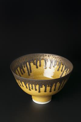 Lot 145 - ‡Lucie Rie (British, 1902-1995)
Footed bowl
in mustard yellow glaze, with running manganese