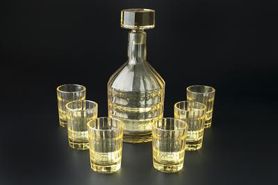 Lot 175 - Art Deco
Liquer set, in yellow cut glass
probably French
comprising decanter and six drinking