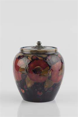 Lot 195 - William Moorcroft (British, 1872-1945)
'Pomegranate' biscuit barrel and cover
with pewter