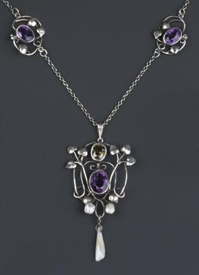 Lot 226 - Arts & Crafts
Amethyst, zircon and baroque pearl pendant, circa 1910 - 1915
scrolled wirework and